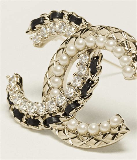 chanel metal and lambskin brooch